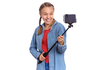 Beautiful teenage girl holds with selfie stick in her hands, isolated on white background