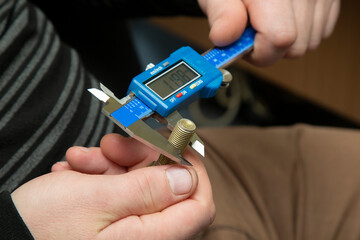 Digital caliper in the hands of the master.