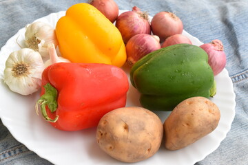 health and colorful vegetables on a white plate