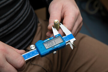 Digital caliper in the hands of the master.