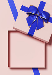 Minimal copy space for Christmas, New year and holiday season. Open pink gift box with blue ribbon bow on pink background. 3d render illustration. Clipping path of each element included.