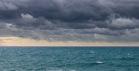 very cloudy sky above the sea