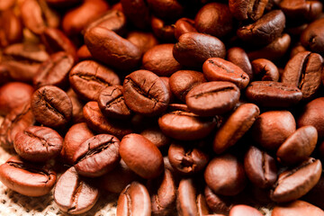 Fototapeta premium Roasted coffee beans background, Close up photo of coffee
