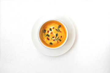 Vegan pumpkin soup on white background