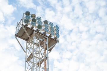 Floodlights over the field with clouds