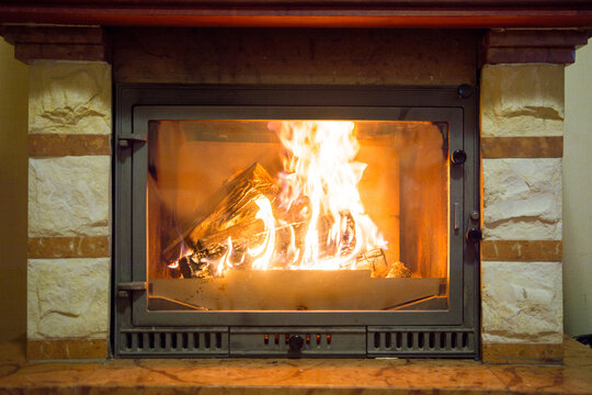 Burning fireplace. Fireplace as an interior item for a designer