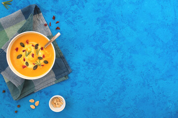 Pumpkin soup on blue napkin