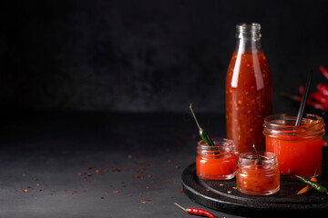 homemade hot chili sauce in glass jars
