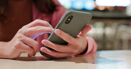 Woman use of mobile phone in restaurant