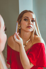 woman applying make up