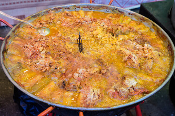 Freshly cooked large portion of cabbage rolls with meat and cabbage, a traditional Romanian food called sarmale cooked at a food market.