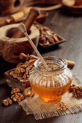 Honey and walnut on a old wooden table.