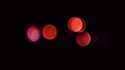 Abstract background,red bokeh lights,beautiful wallpaper, festive lights,circles illustration on a black background