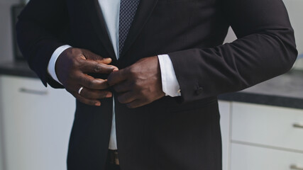 Man Buttoning the Jacket - Stylish African American. High quality photo