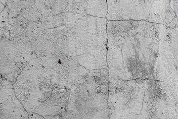 Obraz premium Texture of a concrete wall with cracks and scratches which can be used as a background