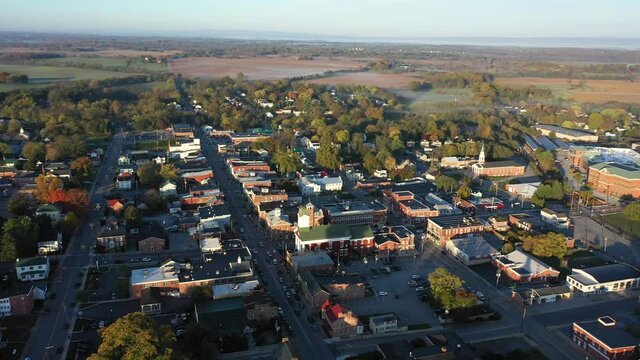 Aerial Orbit Around Charles Town, WV Showing Ranson And The American Public University Campus With Fog Settling On The Countryside.