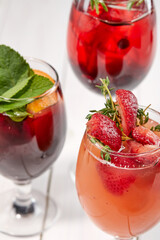 summer cocktail with fresh berries and fruits