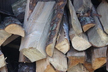 short wooden wet fresh logs as background. Rural country life concept background