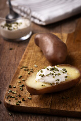 Cream potato presented on a wooden board