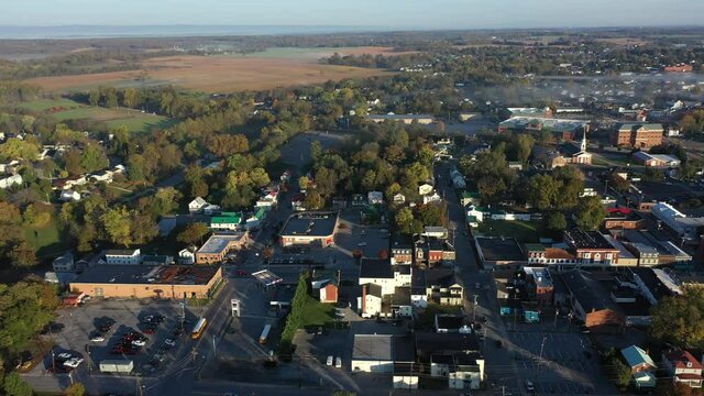 Aerial Trucking Shot To The Right Showing Charles Town And Ranson, WV And American Public University, With Fog In The Countryside On An Autumn Morning At Sunrise.