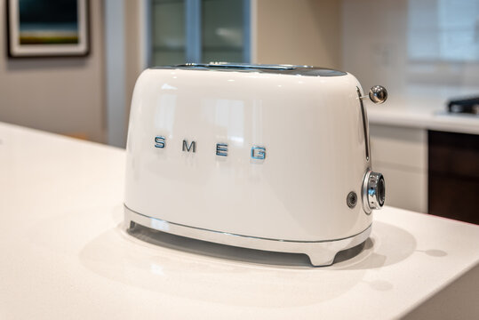 SMEG toaster in modern white kitchen.
