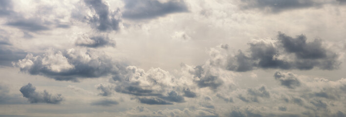 Beautiful row of clouds against the gray sky. Cloudy weather