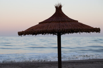 Straw umbrellas on the beach