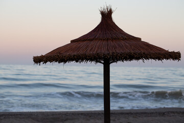 Straw umbrellas on the beach