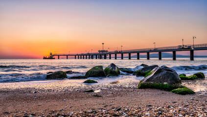 sunrise at the pier and the beach