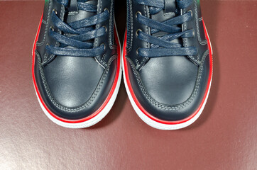 black sports shoes with white soles close up