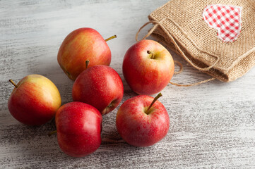 Ripe red apples and bag