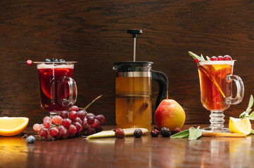 Various autumn or winter seasonal alcohol hot cocktails. Blueberry mulled wine, tea with pear and...