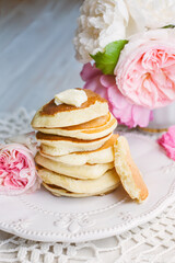 stack of pancakes on white plate with lovely pink roses, shabby style breakfast