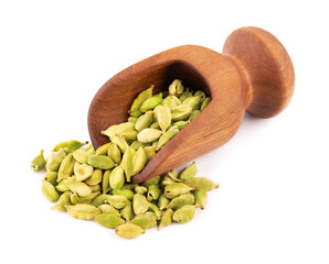 Cardamom seeds in wooden scoop, isolated on white background. Pile of green cardamom pods.