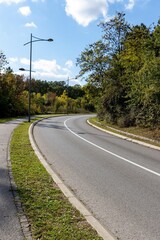 A section of a motor road with a turn on an uphill and limited visibility.