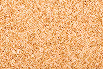 Amaranth seeds background. Organic dry raw amaranth beans. Close-up.