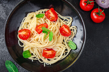 spaghetti pasta with vegetables tomato eat dish top view copy space for text food background rustic
