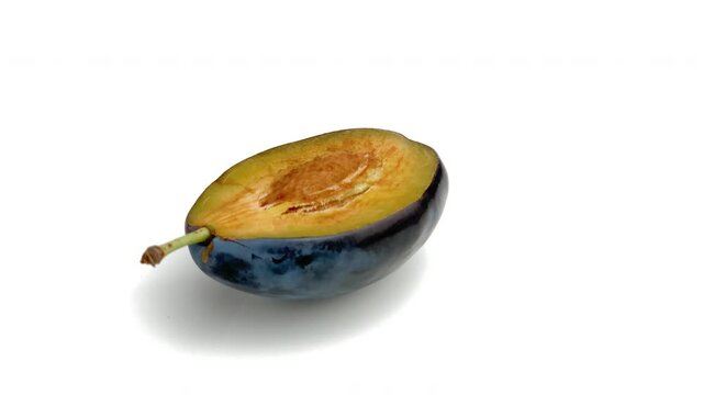 sliced plum isolated on white background
