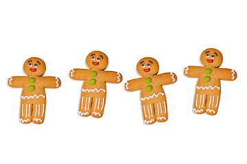 Close up of gingerbread men on isolated white background. Festive decorative gingerbreads for Christmas mood with space for your text. Concept of classic cookie on holiday.