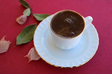 cup of coffee on color background