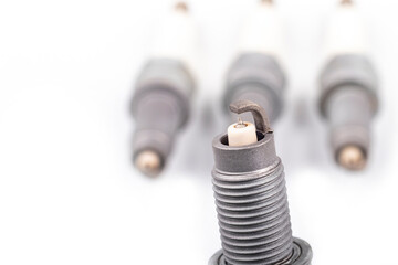 Studio lighting. spark plug from a gasoline engine. It is matte. Close-up.