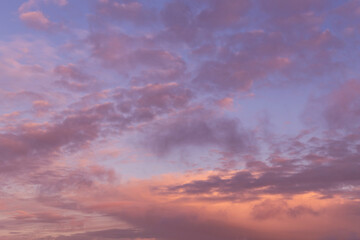 Naklejka na ściany i meble Dramatic soft sunrise, sunset pink violet orange blue sky with clouds background texture