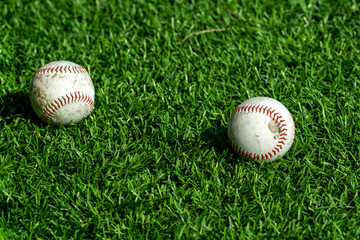 Baseball ball on grass outdoors