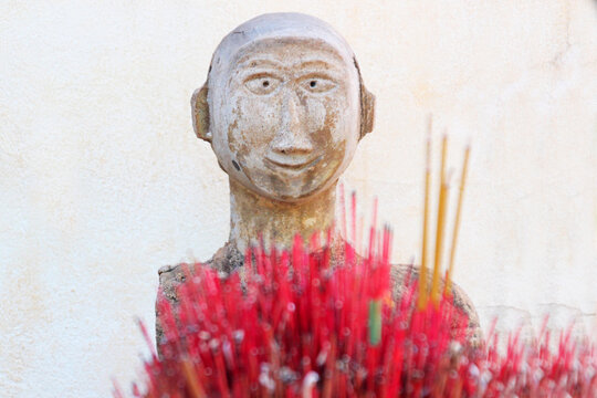 Stone sculpture of a grieving Buddhist monk, 2