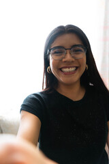 woman taking a photo at home