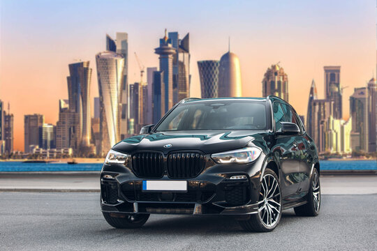 BMW X5 G05 at the parking in front of Dubai skyline 