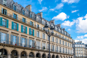 Paris, the beautiful Rivoli street, typical facade and windows
