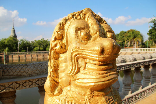 Sculpture of golden mythical Buddhist lion 1