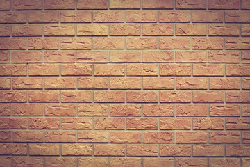 Fototapeta premium Brick texture. Orange background. Brown wallpaper for designer. Rectangular photo with easy vignetting.
