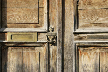 Vintage wooden door to enter the building.